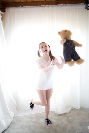 Innocent teen enters the room with Teddy in hands and puts it aside to strip