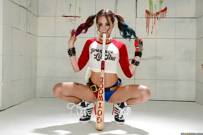 Young woman thinks she is Harley Quinn being shut in a padded cell with a bat