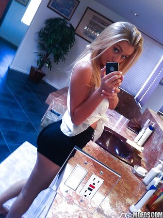 Gorgeous blonde girl Natalia Starr seductively poses in front of mirror