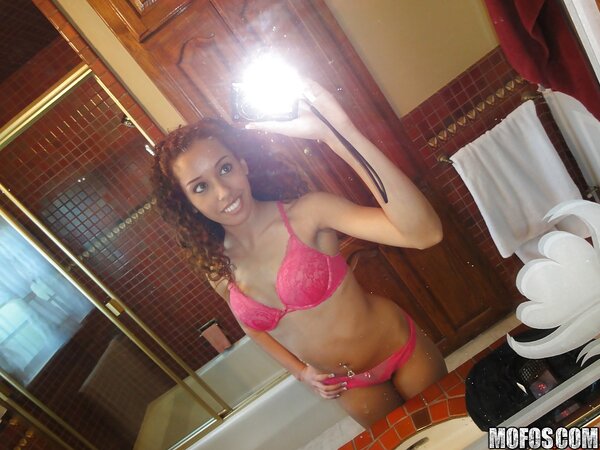 Curly Latina student chick takes some intimate pics in the bathroom