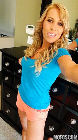 Remarkable blonde hottie takes hot amateur pics of her naked tanned tits