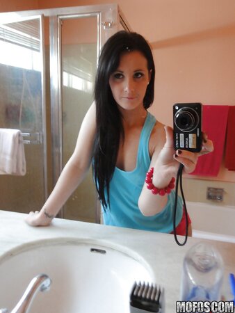Brunette girl decides to take some spicy pics of herself in the bathroom