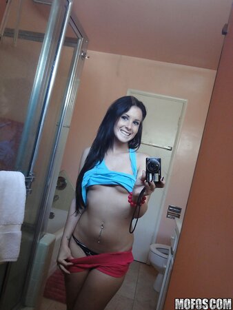 Brunette girl decides to take some spicy pics of herself in the bathroom
