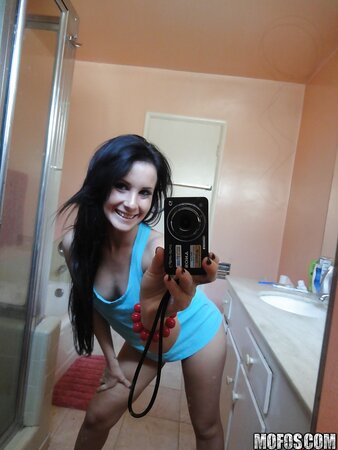 Brunette girl decides to take some spicy pics of herself in the bathroom