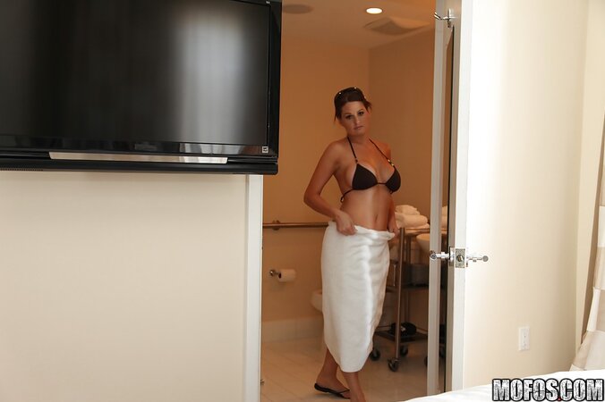 MILF shows off what is underneath her swimsuit before going to tan by the pool