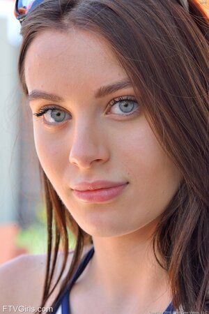 Lana Rhoades posing while wearing sexy shorts during a hike