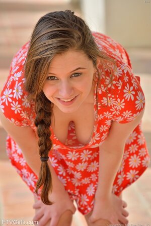 Pigtailed beauty with huge bobs is flashing her perfect cunt