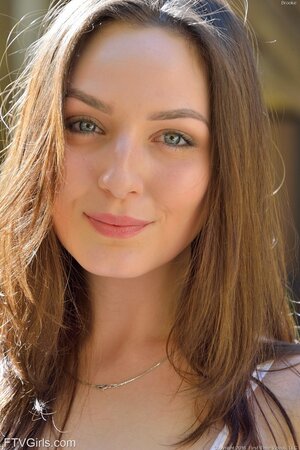 Public photoshoot featuring a young model with a big bum