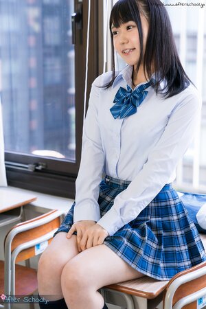 Sexy Asian schoolgirl exposes her tight ass in the classroom