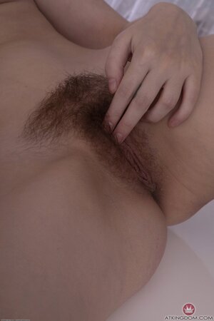Brunette with sexy eyes and a perfect bush being cutesy