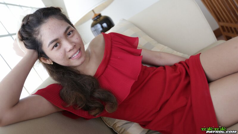 Sweet Thai teen has fun walking with a foreign photographer