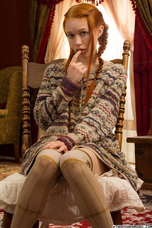 Redheaded Dolly Little is a little too horny to stay still