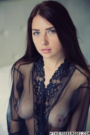 Brunette with nice boobies is showing off her ass and breasts