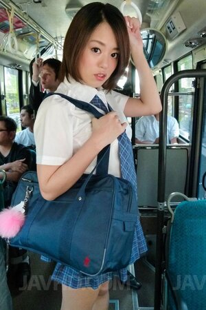 Arisa Suzuki's hairy pussy is exposed during a wild public gangbang