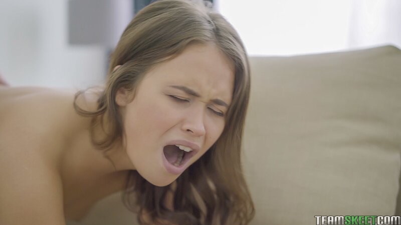 Cute teen Erin performs an ass to mouth blowjob on Jack on the sofa