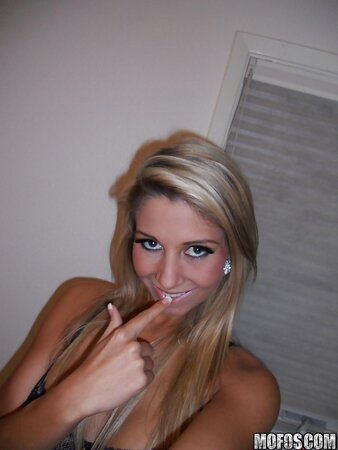 With a smile naughty blonde drops down lace lingerie whilst making selfies