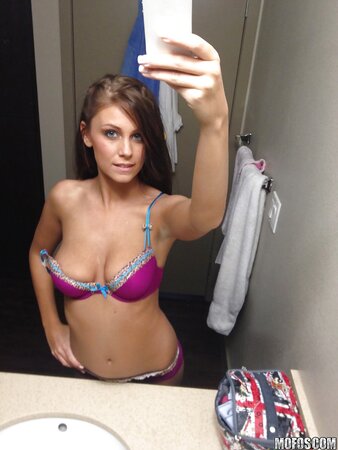 Winsome girl is alone at home and can freely show her natural assets