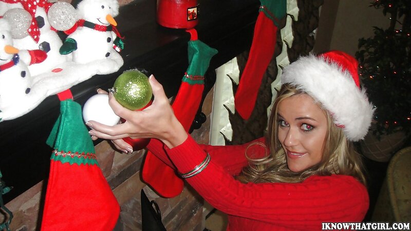 Amateur blonde MILF in sexy Christmas outfit shows off big tits and tight pussy