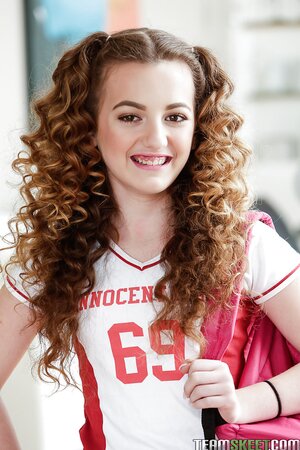 Horny cheerleader demonstrates twat that she didn't shaved for a couple of days