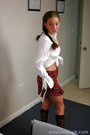 Babe enters the room and takes first white shirt but then checkered skirt