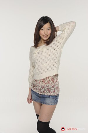 Young Japanese girl poses in short skirt that accentuates her long legs