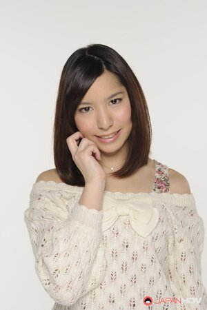 Young Japanese girl poses in short skirt that accentuates her long legs