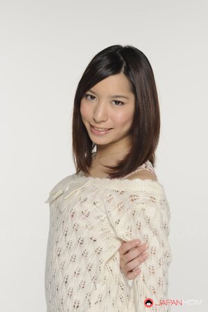 Young Japanese girl poses in short skirt that accentuates her long legs