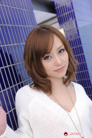 Entrancing Japanese model comes to the roof where flashes breasts and pussy