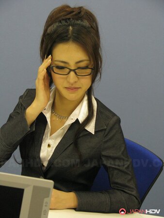 Short skirt of nerdy Japanese secretary can hardly hide her underwear