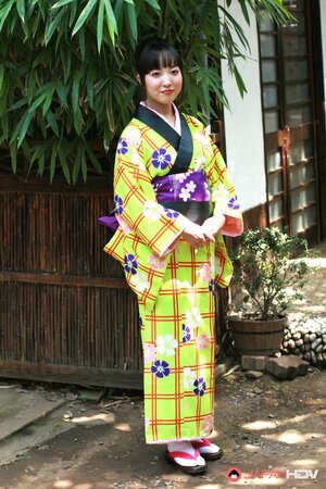 Swanky Japanese woman wears colorful kimono and has no panties under it