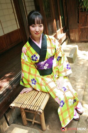 Swanky Japanese woman wears colorful kimono and has no panties under it