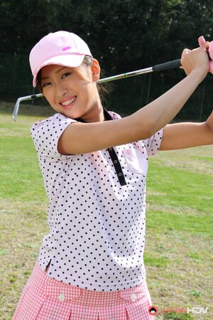 Oriental golf girl wears shirt and skirt but dislikes panties and flashes muff