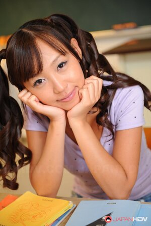 Cheerful Japanese coed with pigtails is shy about showing tits and pussy
