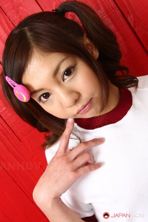 Petite Japanese babe in white stockings with slender body poses on camera