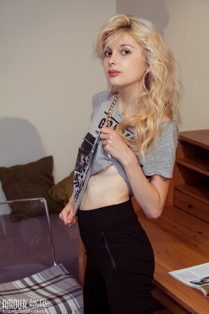 Angelik peels off her clothes to spread naked at her desk