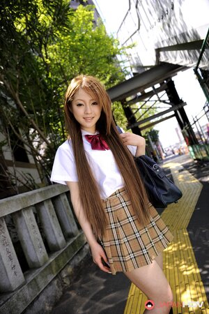 Japanese schoolgirl Ria Sakurai flashes sexy panties outside