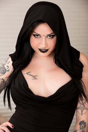 Stunning goth Ophellia Rain displays her big tits after undressing