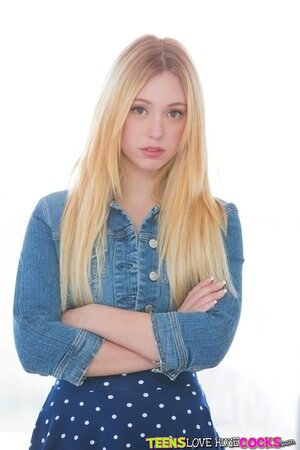 Lucy Tyler demonstrates her shaved pussy and tight ass
