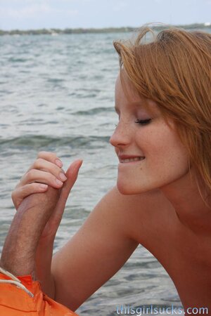 Katey Grind wanks and sucks a huge penis on the beach