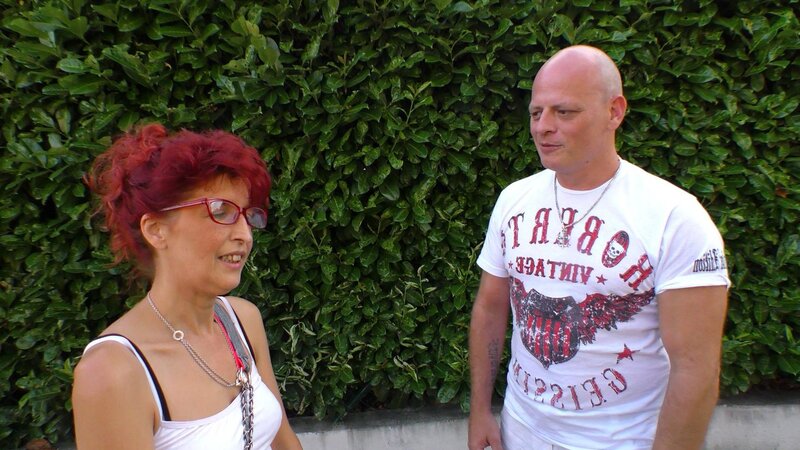 Mature redhead Evelyn S gets penetrated deep by a bald man right on the grey sofa