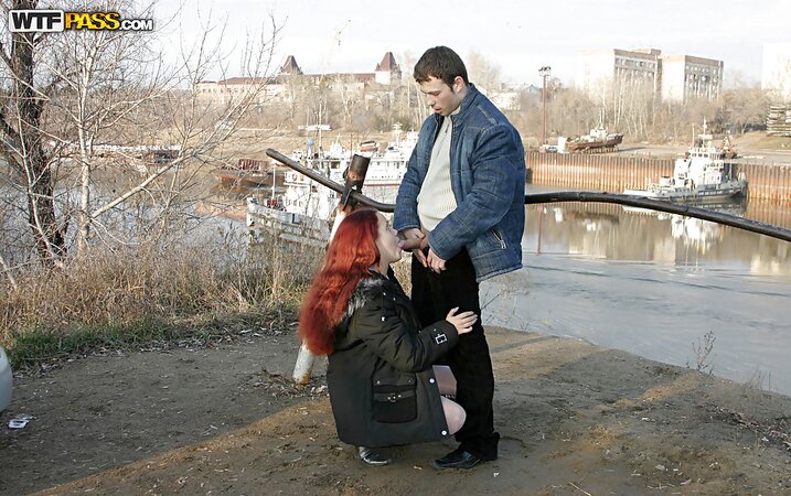 Red-haired bitch in nylons and jacket sucks dick and fucks on a cold day outdoors