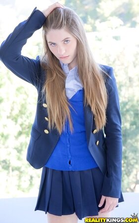 Enticing schoolgirl with sexy long hair Alice March flaunts her beautiful body