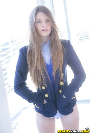 Enticing schoolgirl with sexy long hair Alice March flaunts her beautiful body