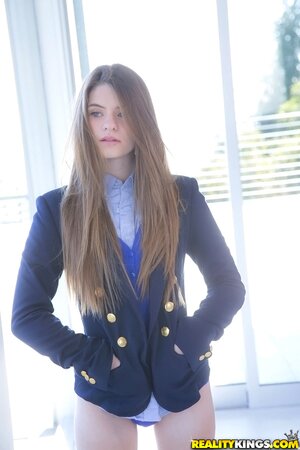 Enticing schoolgirl with sexy long hair Alice March flaunts her beautiful body