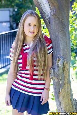 Student chick Madison Chandler playfully shows off tits, pussy, and butt outside