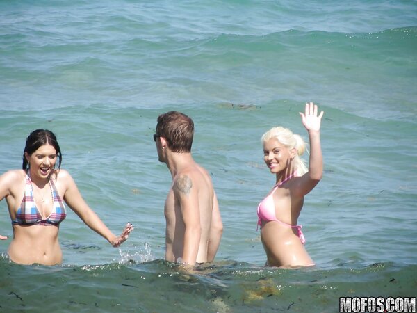 Seductive girls in bikinis like to spend good time and pose on the beach