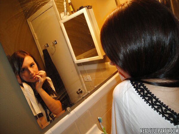Attractive girl wants to gladden boyfriend and poses naked in the bathroom