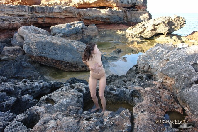 Merciless male submerses face of skinny teen with tied up hands in water