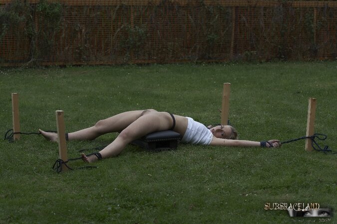 Poor blonde punished in backyard by guy who loves to use whip and wax