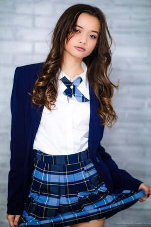 Delectable college girl with small tits waits for a moment to take off uniform